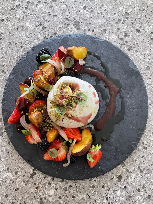 Burrata, smoked stone fruit, pickled fennel, sour cherry reduction, basil EVOO, pistachio.